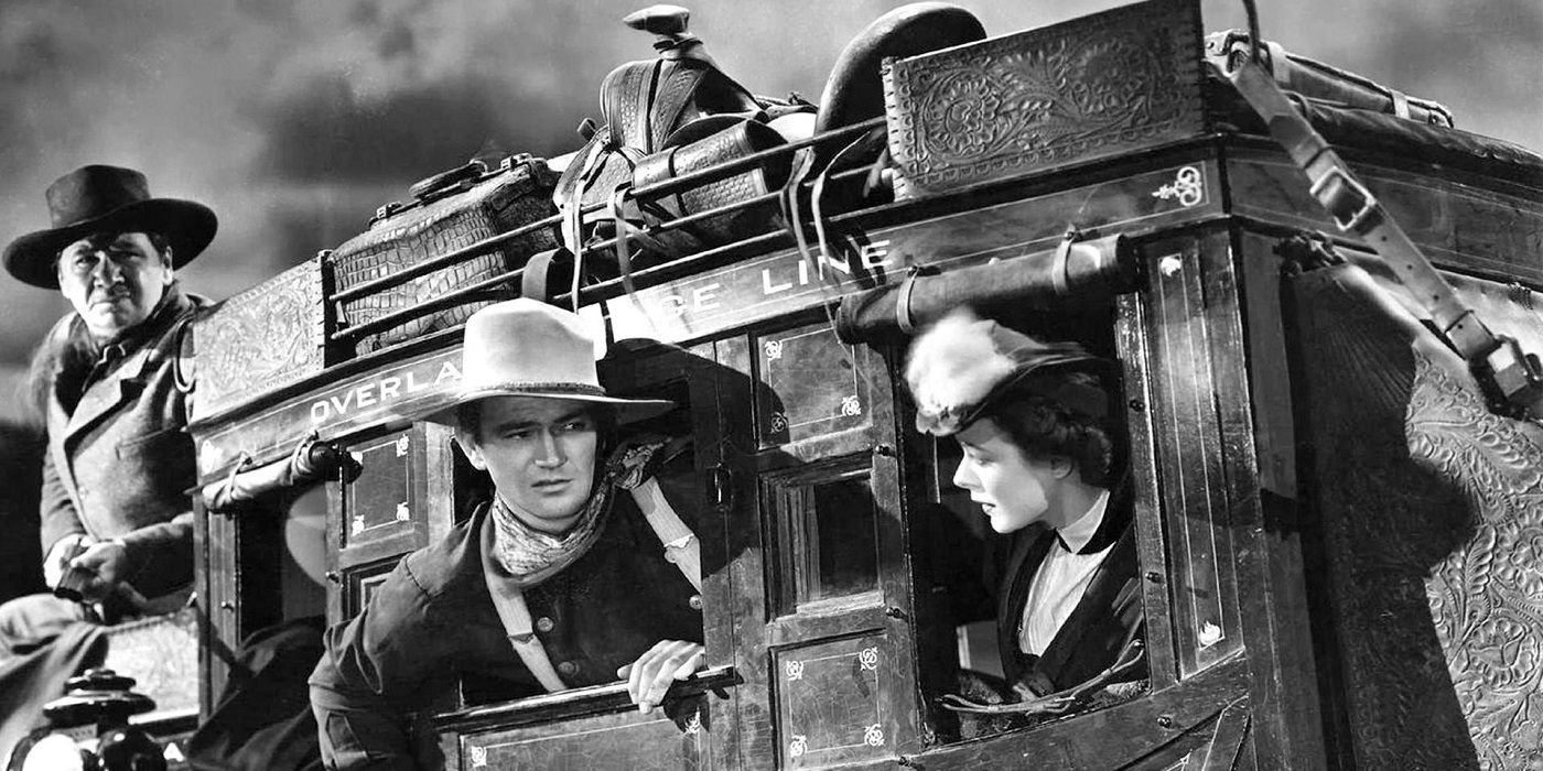 John Wayne habla con otros personajes de la película Stagecoach