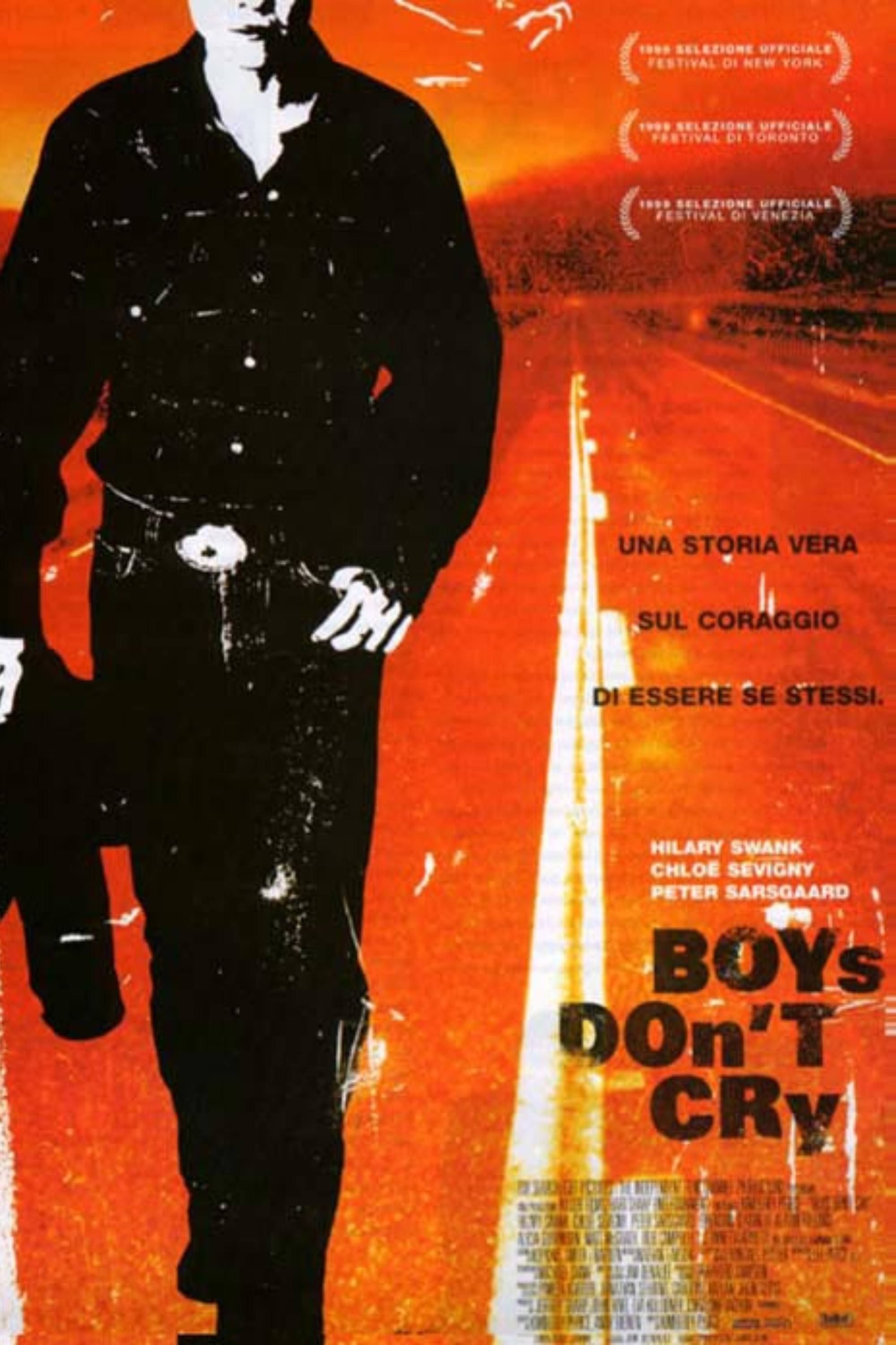 El cartel de Boys Don't Cry muestra a un hombre caminando por una carretera sombreada en tonos naranjas.
