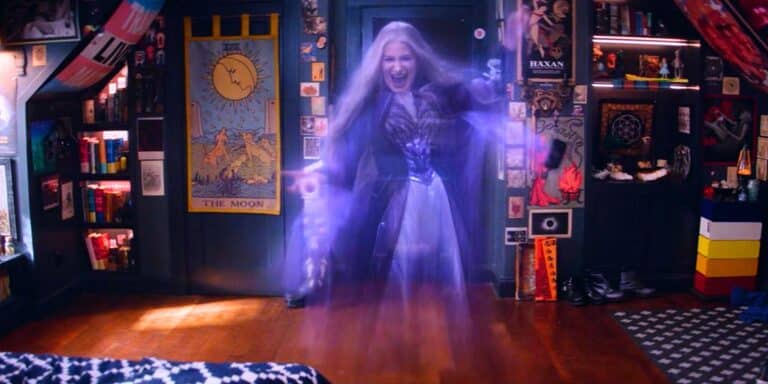 Kathryn Hahn as ghost Agatha Harkness smiling and laughing in William Kaplan's bedroom from Agatha All Along