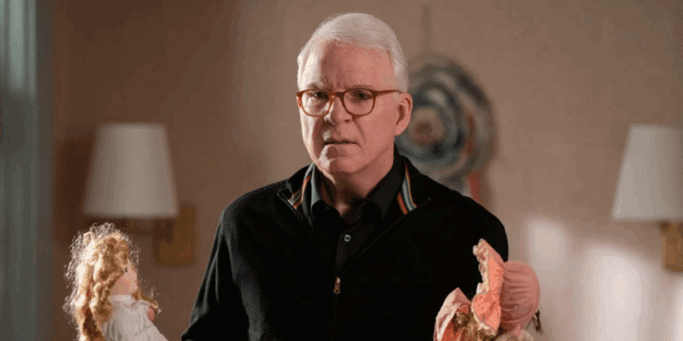 Charles (Steve Martin) holds two dolls in only murders in the building.