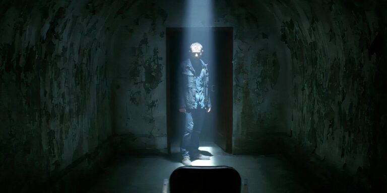 James enters a dark room in the empty man 2020