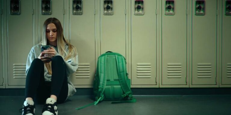 Lauryn Lacari seated in the lane of the school in unknown number